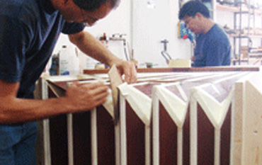 Re-leathering a wedge-type bellows for the restoration of an historical organ.